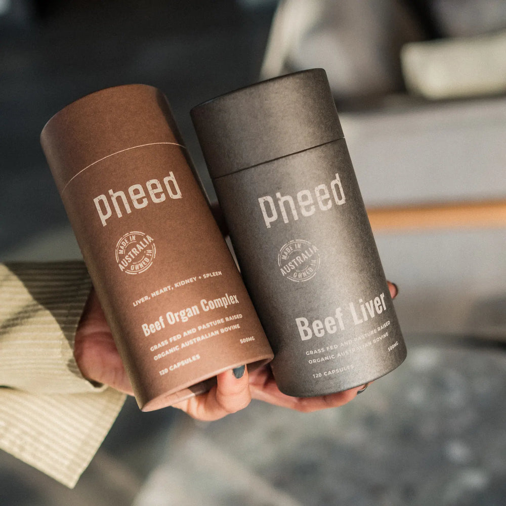 Pheed Beef Organ Complex and Beef Liver tubes held side by side in one hand.
