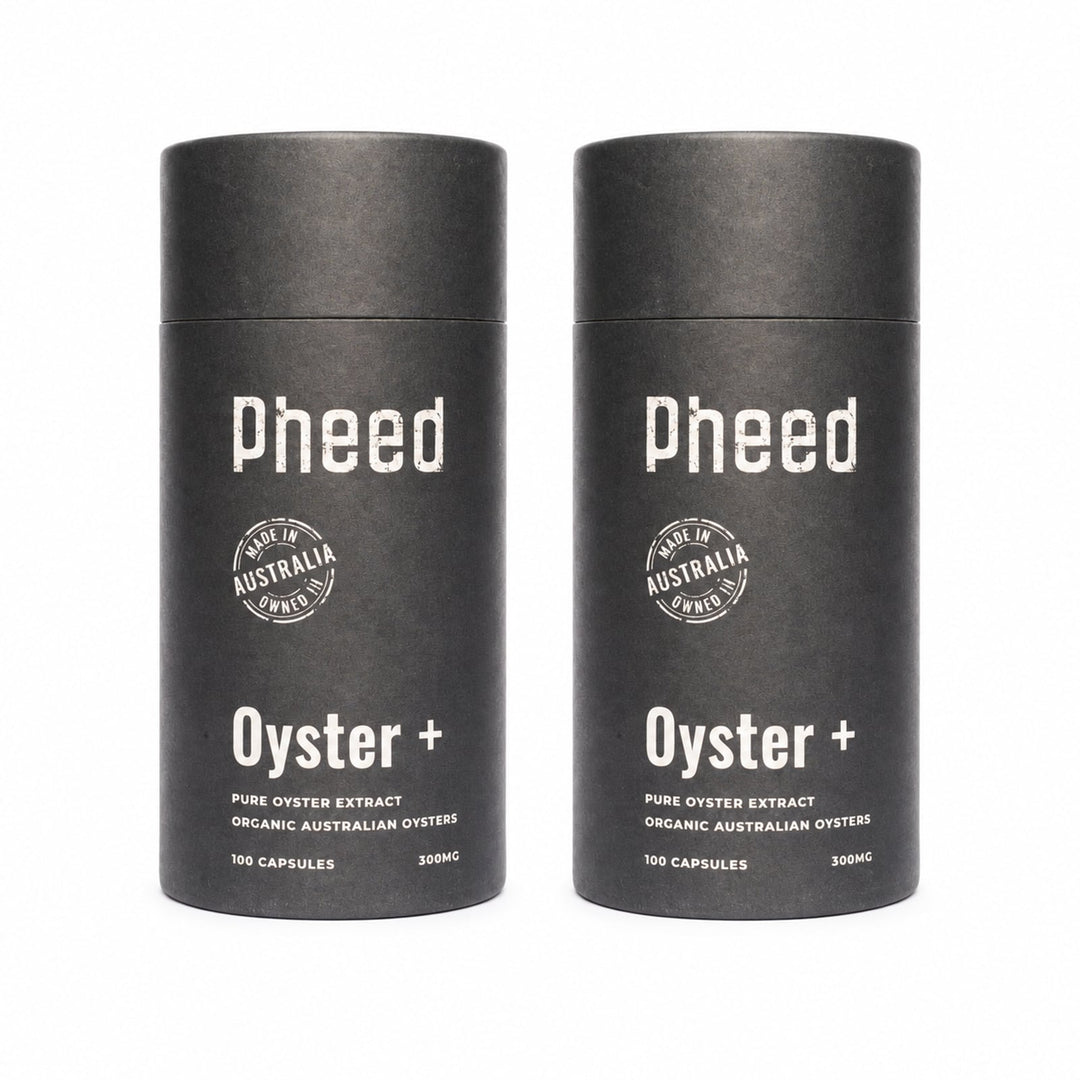 Two Pheed Oyster+ capsule bottles standing side by side on a white background.