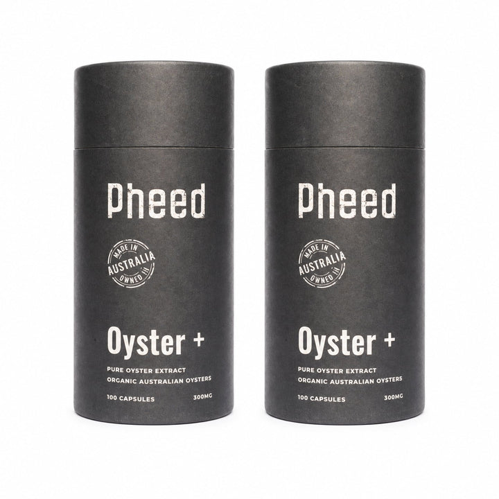 Two Pheed Oyster+ capsule bottles standing side by side on a white background.