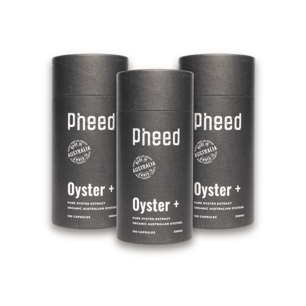 Three cylindrical containers of oyster capsules labeled 'Pheed Oyster+' on a white background
