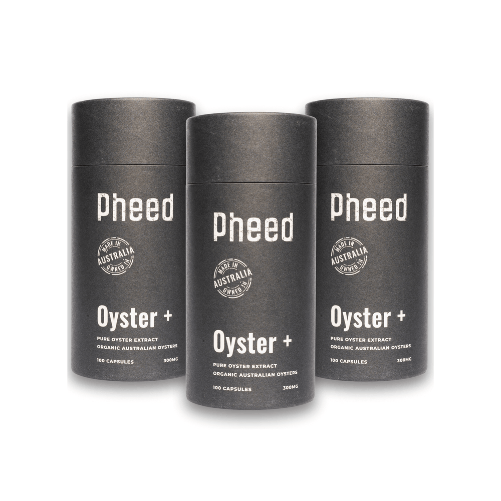 Three oyster capsule cylindrical containers labeled 'pheed' on a white background