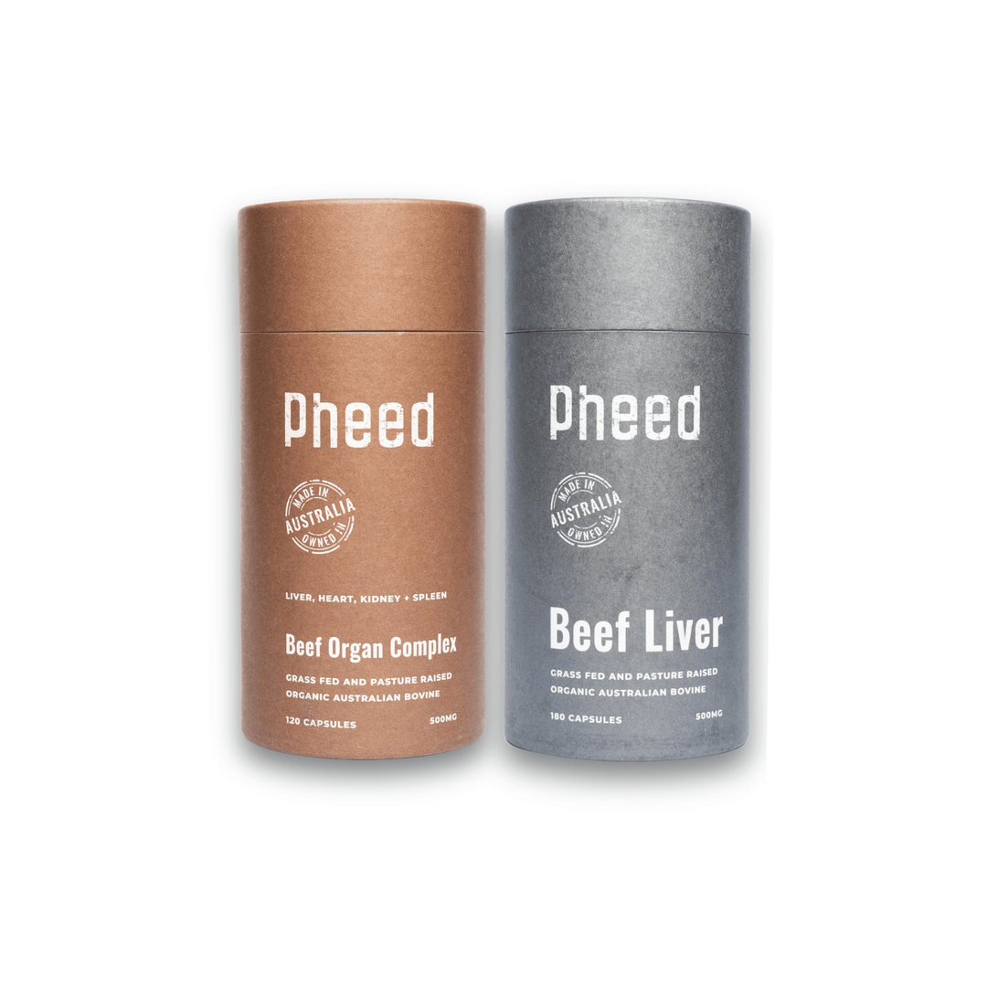 Two cylindrical containers with beef organ capsules and beef liver capsules labeled 'Pheed' on a white background