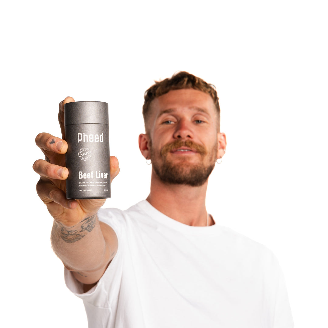 Man holding Beef Liver capsules on white background