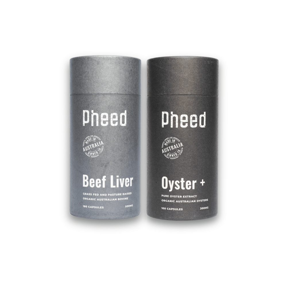 Two gray cylindrical containers labeled 'Pheed' for beef liver and oyster capsules on a white background.