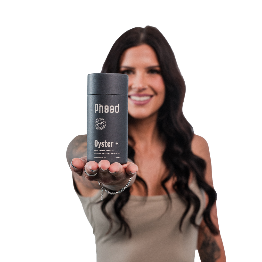 Woman holding a container labeled 'Pheed Oyster' against a white background